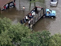 Truck picking up flood victims with no way out.